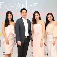 a group of women posing for a photo with the words enhance your beauty